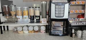 a kitchen with a counter with many different items at Alessio Camere in Bardolino