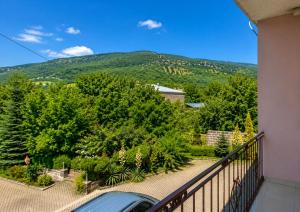 a balcony with a view of a mountain at Zanger Hotel in Goris