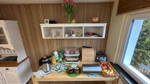 a kitchen with a counter with food on it at Franky House am Nürburgring in Quiddelbach