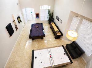 an overhead view of a living room with a pool table at Summerlin Private Buddha Estate Resort - Pool, Spa, Sauna, Game Room, Basket ball, Mini golf, Gym in Las Vegas