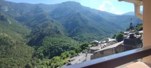 a view of a mountain valley from a balcony at Le Mazet in Nohèdes +8 photos