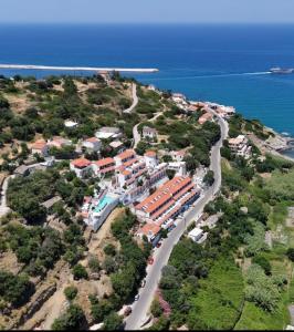 an aerial view of a resort on a hill next to the ocean at Sea View Kerame in Evdilos