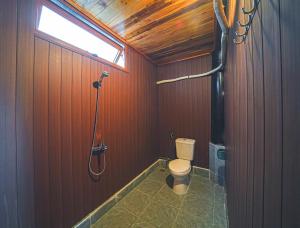 a bathroom with a shower and a toilet at Leaf Village & Farm Làng Lá in Danang +52 photos