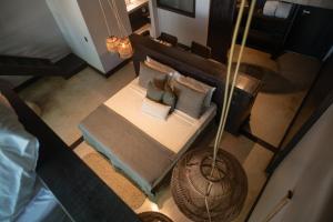 an overhead view of a bed with pillows on it at Vila Torém in Icaraí