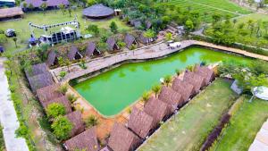 an aerial view of a pool of water in a yard at Leaf Village & Farm Làng Lá in Danang