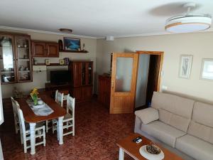 a living room with a couch and a table at Apartamentos Ruidera in Ruidera