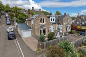 an aerial view of a house with a car parked in front at Hermitage Suite - Stylish Shared Accommodation in Dundee