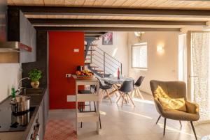a kitchen and living room with a table and chairs at Casa Quadrifoglio - Ticino in Intra +21 photos