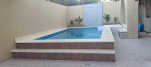 a swimming pool in the middle of a building at Healing House in Luxor