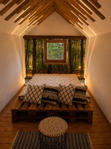 a bedroom with a bed in a room with a window at Cityside Cottage in Eger