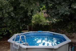 a large swimming pool in a yard at Can Quel in Canet de Adri