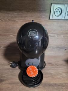 a black helmet sitting on top of a table at Apartmány MALIK in Dolní Dunajovice