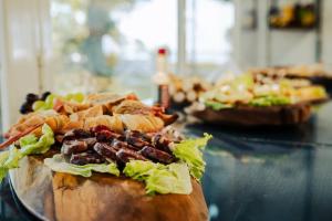 a table with two sandwiches on a glass table at Rincon del Dorado Lodge in Goya
