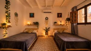 a room with two beds in a room at Cozy Dahab Studio with Private Courtyard in Dahab