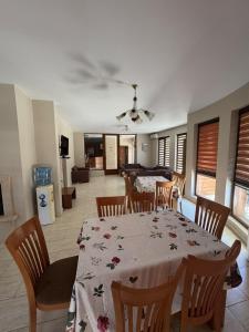 a dining room with a table and chairs at Yuliya Guest House in Sapareva Banya +42 photos