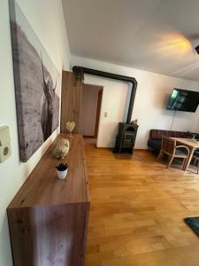 a living room with a table and a couch at Ferienhaus Ute in Irschen