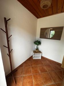 a room with a plant on a tiled floor at Ferienhaus Ute in Irschen