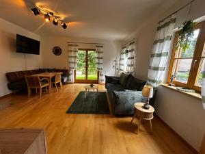 a living room with a couch and a table at Ferienhaus Ute in Irschen +22 photos