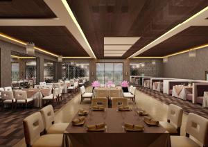 a rendering of a restaurant with tables and chairs at 7 Seasons resort & Spa in Jamnagar +15 photos