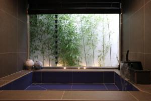 a large window in a room with a blue tile floor at Hotel Jak Insadong by Anook in Seoul +80 photos