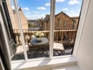 a view from a balcony with a table and chairs at Castle Chambers Serviced Apartments in Lancaster