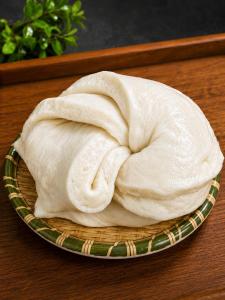 a towel on a plate on a table at Lungta Homes in Bomdila