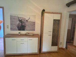 a room with a picture of a bull on the wall at Ferienhaus Ute in Irschen
