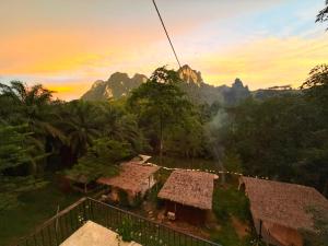 a gondola ride over the mountains at sunset at Amornkeeree Khao Sok Camping in Khao Sok National Park