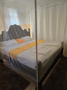 a bed in a tent in a room at Rose Petals in Sagana