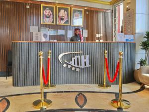 a display in a store with red and white ribbons at Al Mukhtara Almasi Hotel - شركة المختارة الماسي للخدمات الفندقيه شخص واحد in Medina