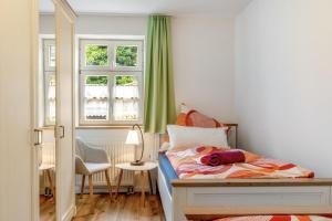 a bedroom with a bed and a window at Zeitlos Wriezen 1 in Wriezen