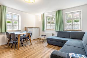 a living room with a couch and a table at Zeitlos Wriezen 1 in Wriezen
