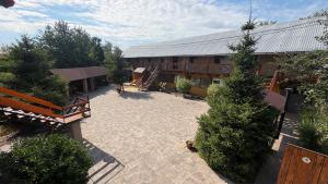 an overhead view of a courtyard with trees and a building at Мотель Ріта in Berehove