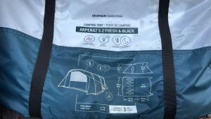 a blue and white bag with a drawing on it at Gio Camping Shala River in Mollʼ e Shoshit