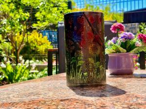 a vase sitting on top of a table with flowers at Padova Cottage in Padova
