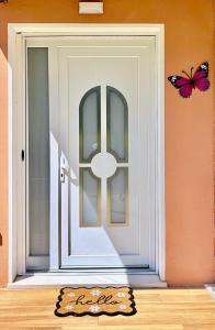 a door with a butterfly on top of it at Padova Cottage in Padova +25 photos