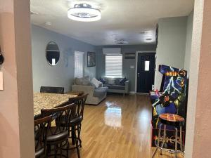 a kitchen and living room with a table and chairs at Pool house , near downtown SA in San Antonio +7 photos