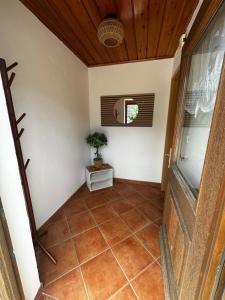 a hallway of a house with a plant on the floor at Ferienhaus Ute in Irschen