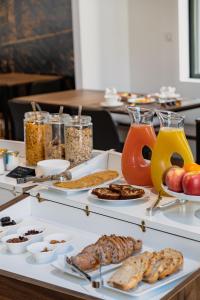 a buffet with various food items on a table at Hôtel In Situ in Béziers