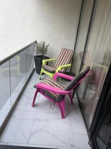 a couple of chairs sitting on a balcony at Geo Saturn in Saturn