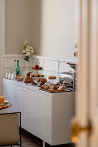 a kitchen with a counter with food on it at L'Hôtel Particulier Beziers in Béziers