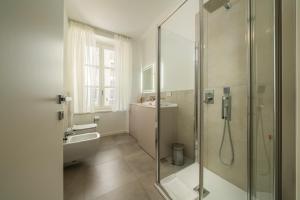 a bathroom with a shower and a sink at Flowers Liberty Suites in Brescia