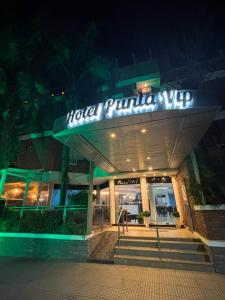 a building with a sign that reads motel pulled up at Apart Hotel Punta Vip in Colón