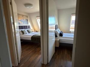 a small room with a bed and a window at Harbour Stay Volendam in Volendam