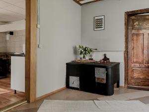 a room with a door and a table in a room at Viesu nams Kātiņi in Energetikis