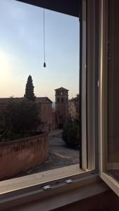 an open window with a view of a street at Mansio Pegaso in Tivoli