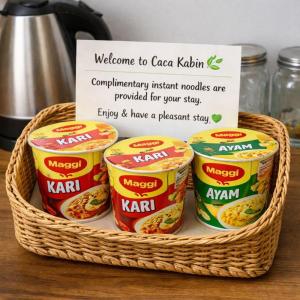 a basket with a bunch of canned food in it at Caca Kabin in Mersing
