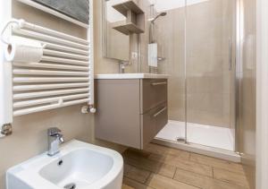 a bathroom with a sink and a shower and a toilet at Moon Bologna in Bologna +77 photos