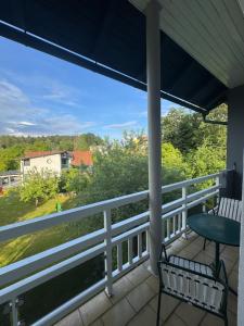 a view from the porch of a house with a chair at Guesthouse Mother in Sielach +6 photos
