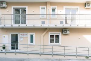 a building with balconies on the side of it at B&B Da Anna in Torretta